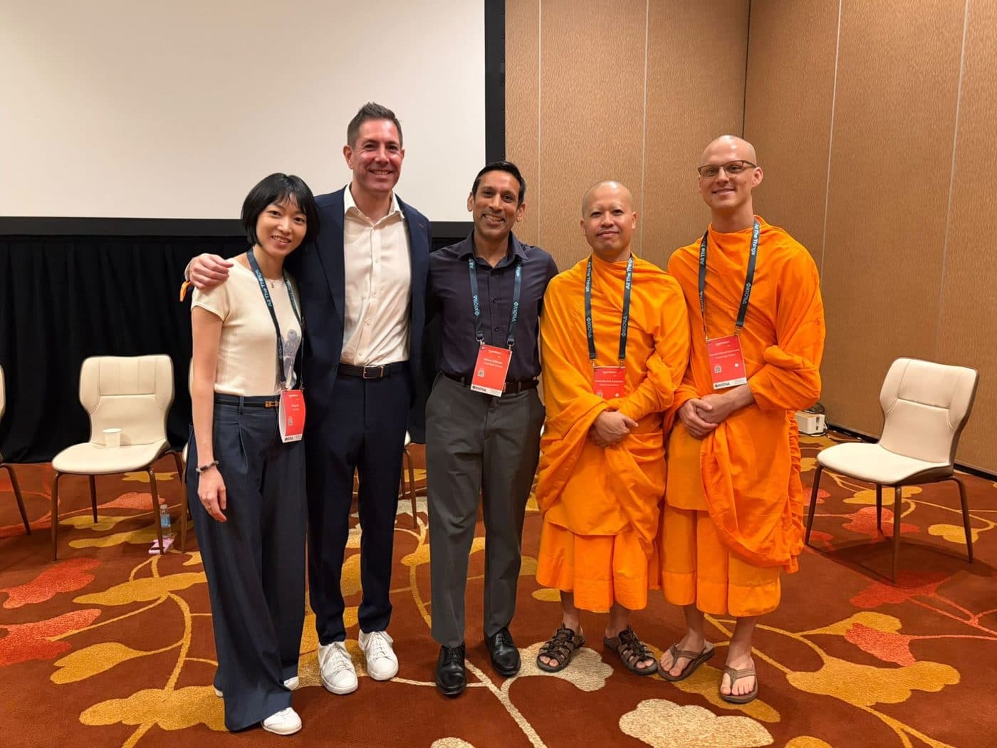 The two monks with Chris Lerner and fellow speakers at SuperReturn Asia